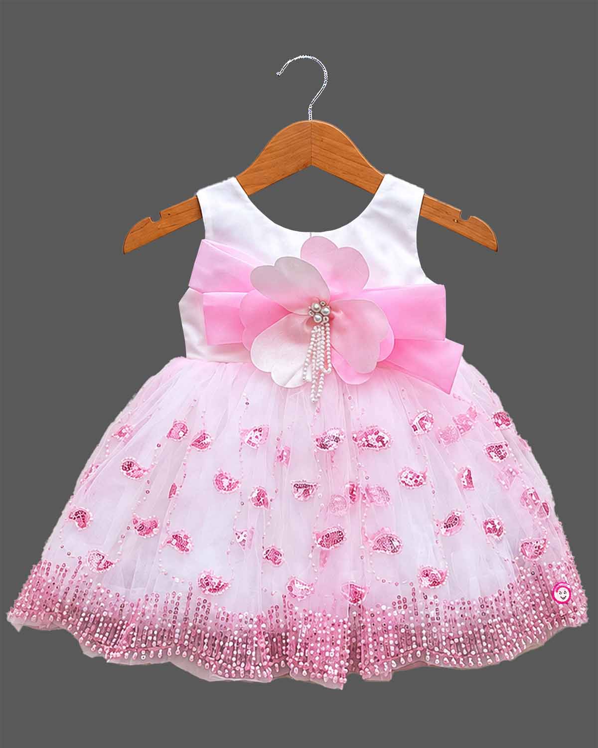 Sleeveless net fit-and-flare girl frock with floral waist appliqué and sequin detailing for parties.