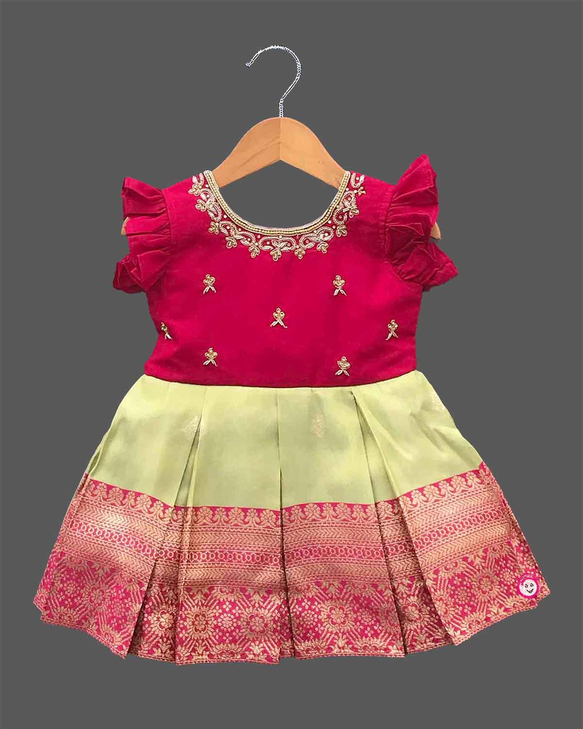 Little girl silk traditional frock with embroidered neckline ruffle sleeves and woven zari border for ethnic celebrations