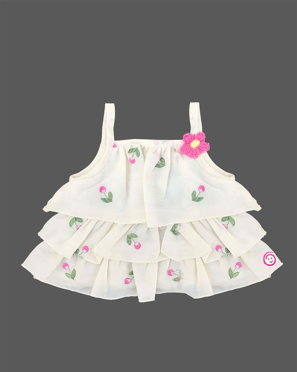 Cream tiered top with pink floral embroidery and bright pink shorts baby girl top and shorts set for summer vacations, playdates, and park outings