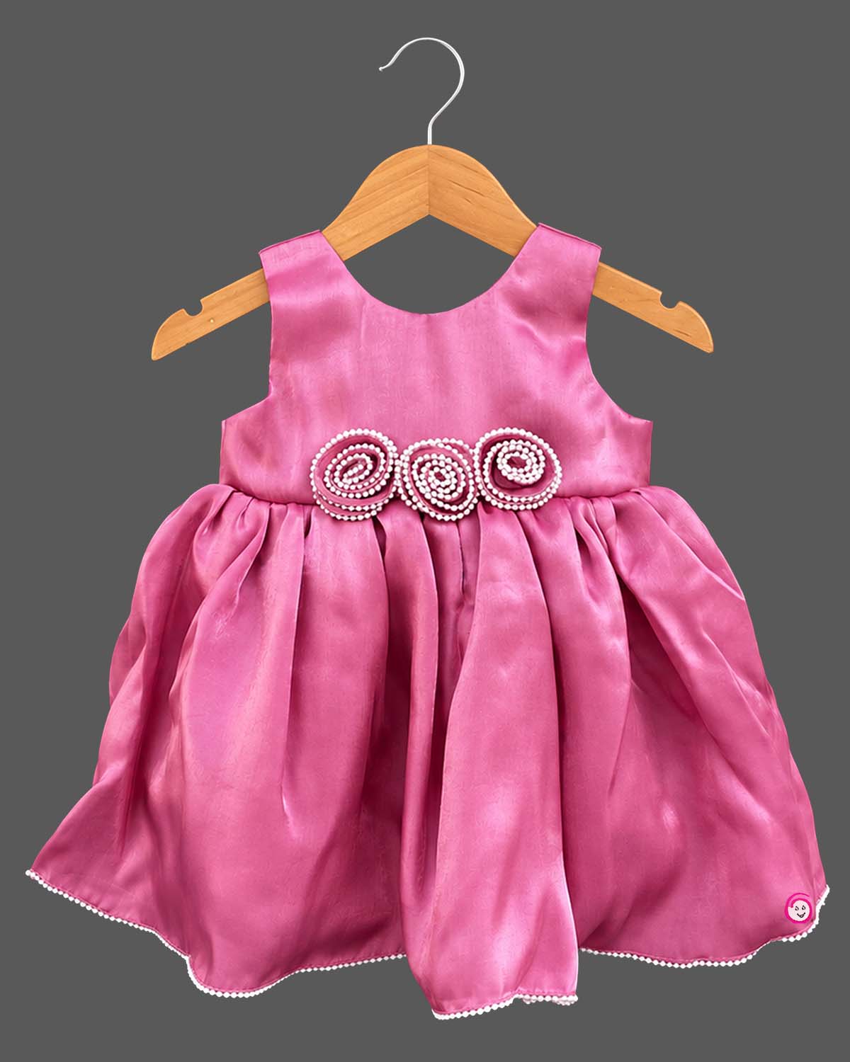Sleeveless satin fit-and-flare dress with pearl rosette waist accents and baby party wear dress detail.