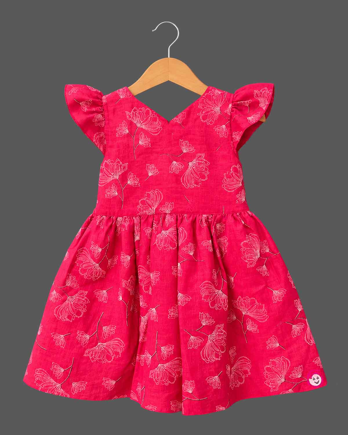 Cotton Frock For Baby Girl with flutter sleeves, V-neck bodice, gathered skirt and sketch floral print
