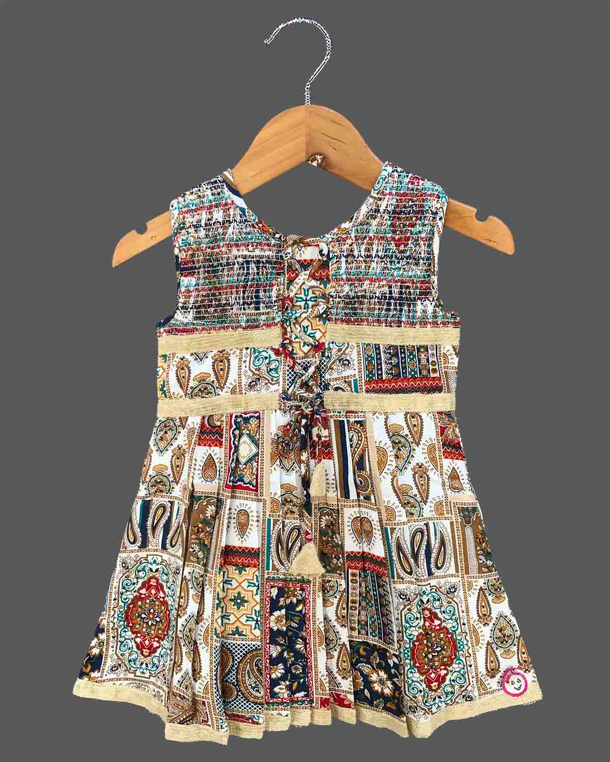 Toddler printed cotton frock with smocked neck and front lace tie ups for casual outing and birthday celebration