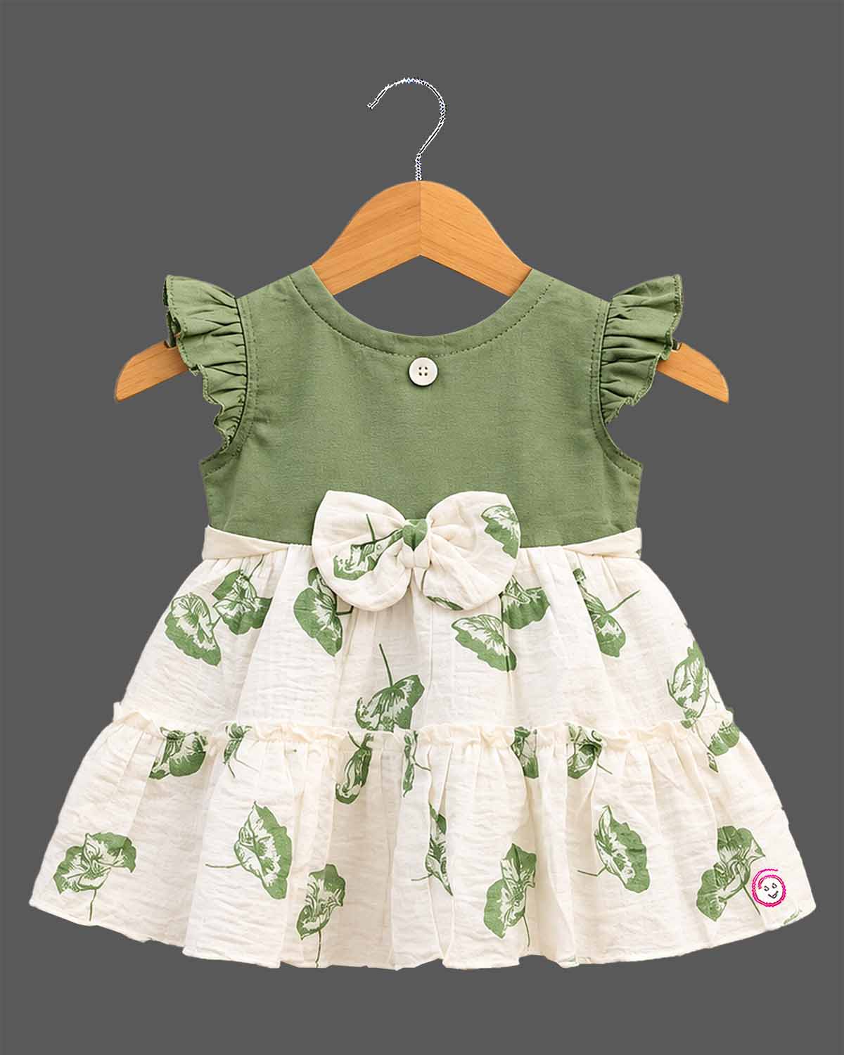 Toddler girls tiered frock featuring ruffled flutter sleeves, a waist bow, and botanical leaf prints.