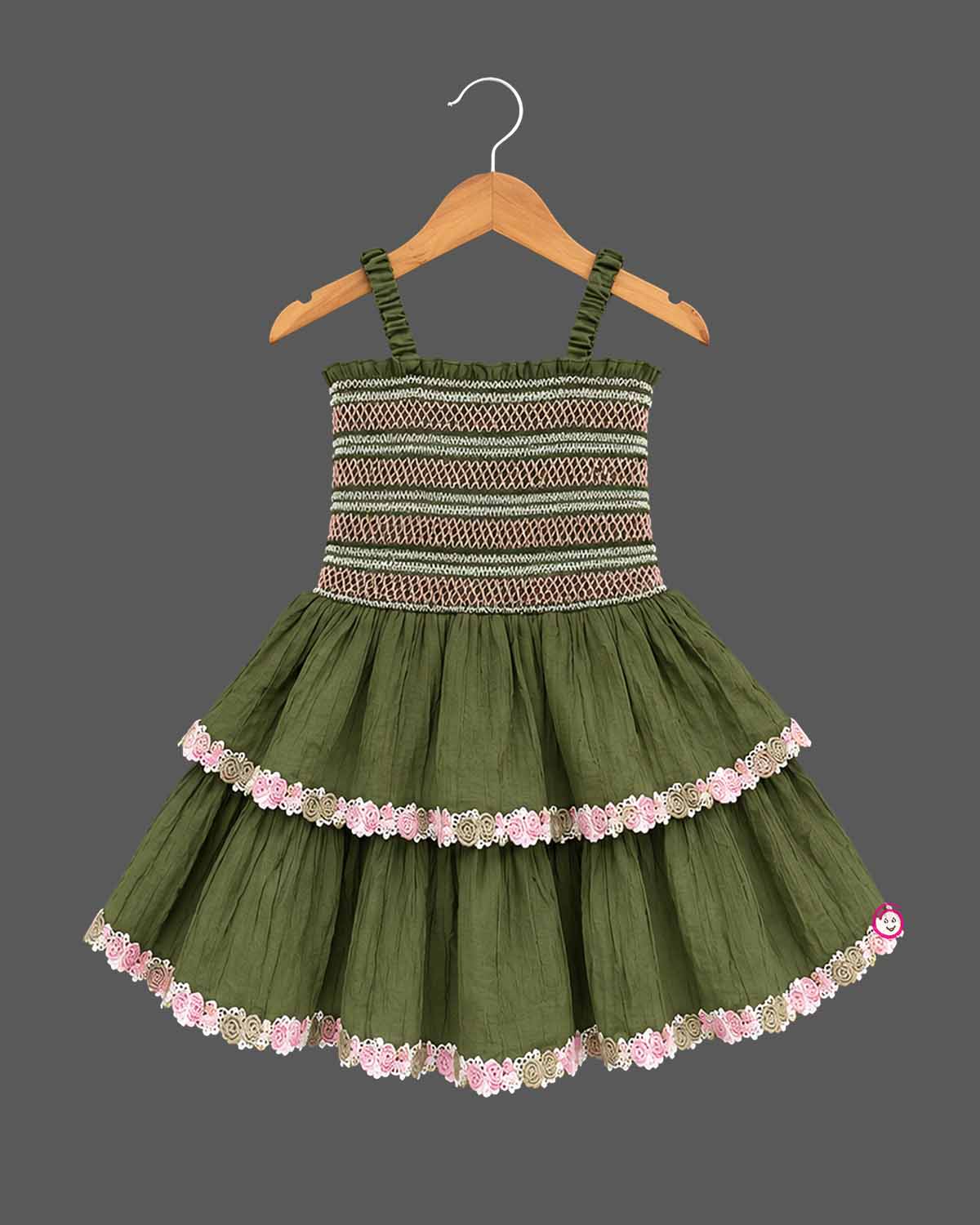 Baby party wear dress with smocked elastic bodice, tiered flared skirt, and delicate lace trim.