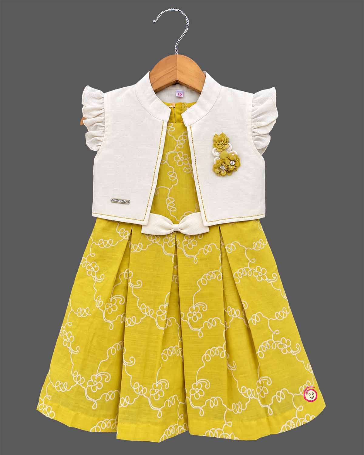 Toddler girl in mustard yellow cotton embroidered casual frock with off-white ruffled jacket