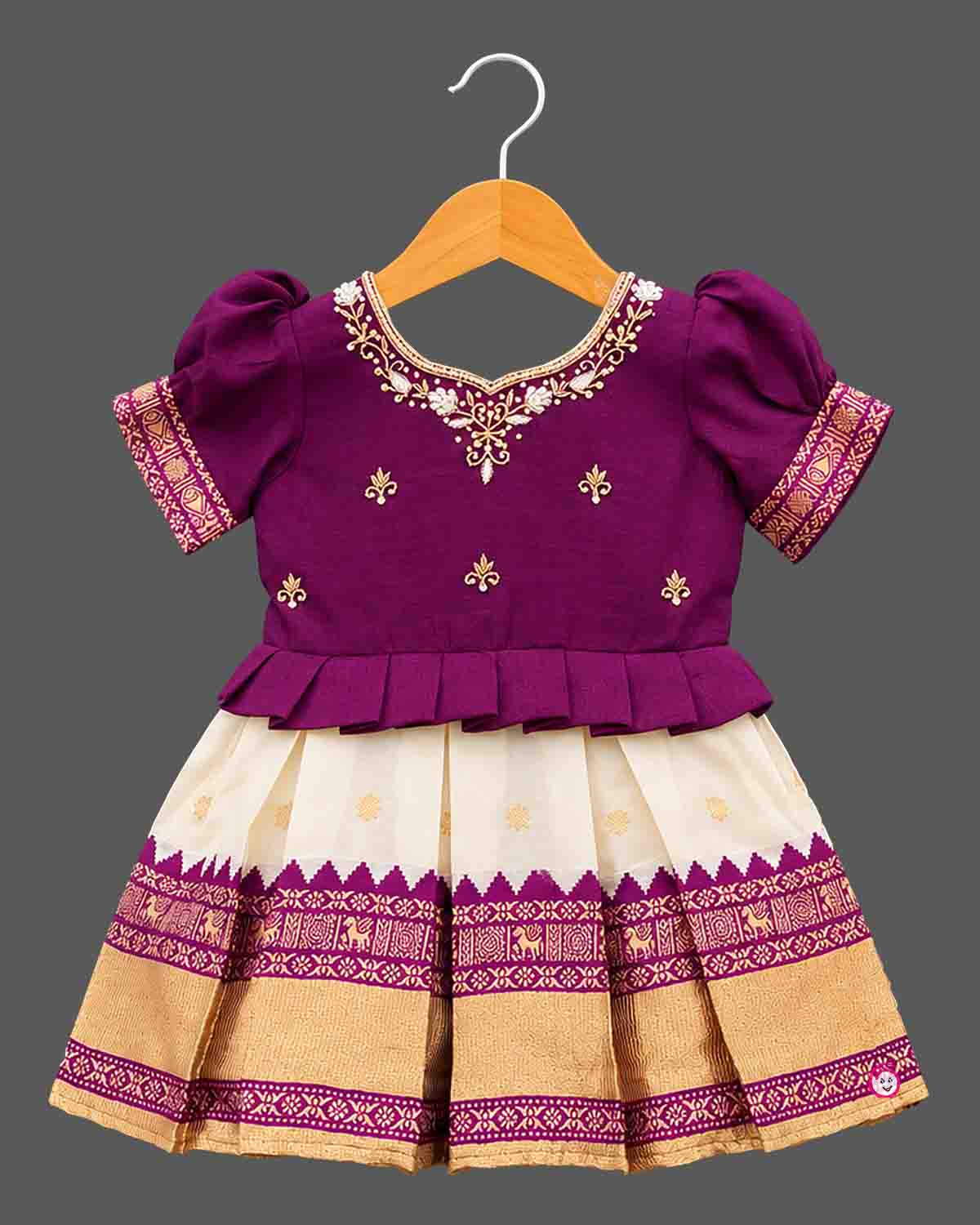Toddle silk cotton frock for kids featuring embroidered puffed sleeves, and woven pleated skirt.