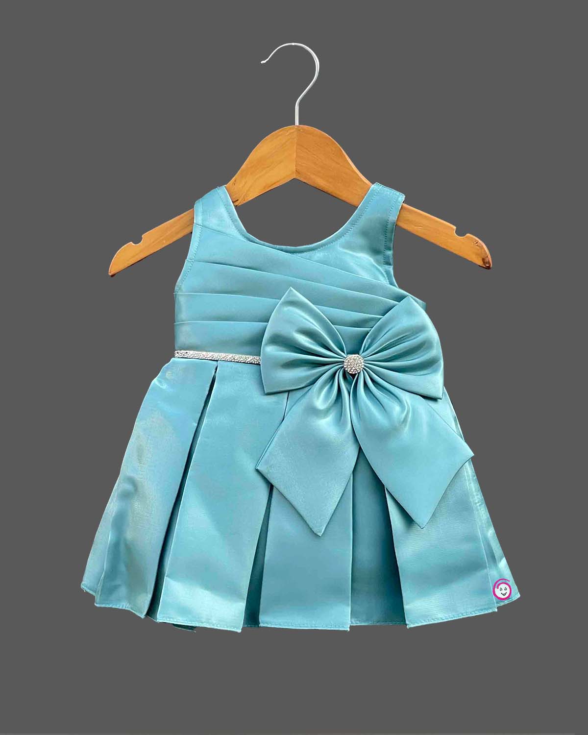 Sleeveless pleated silk frocks for baby girl with oversized waist bow and crystal belt detailing.