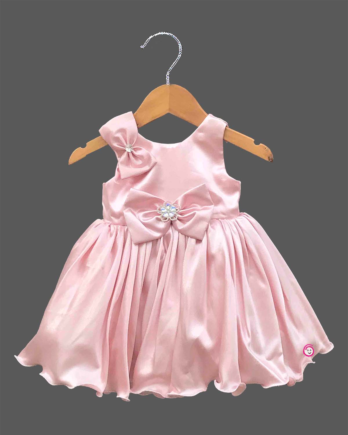 Baby girl satin party frock with bow accent and crystal embellishment for birthday celebration