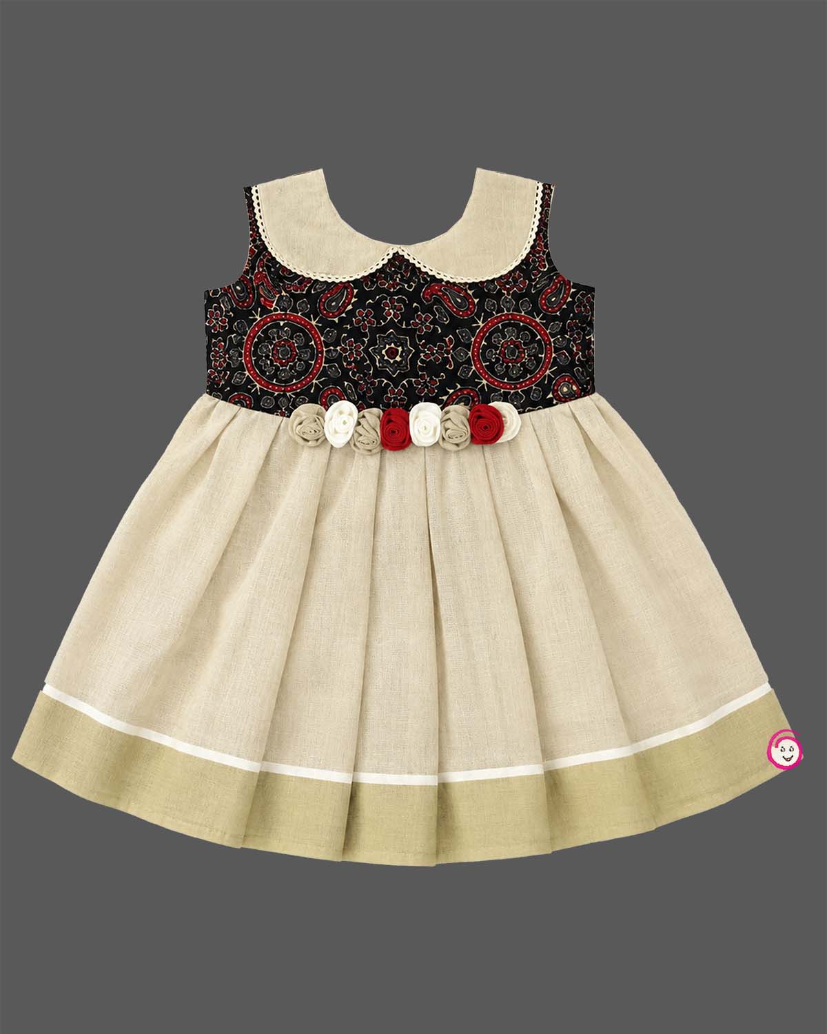 Little one wearing Ajrakh print peter pan collar frock with waist rosette detail and Kasavu border