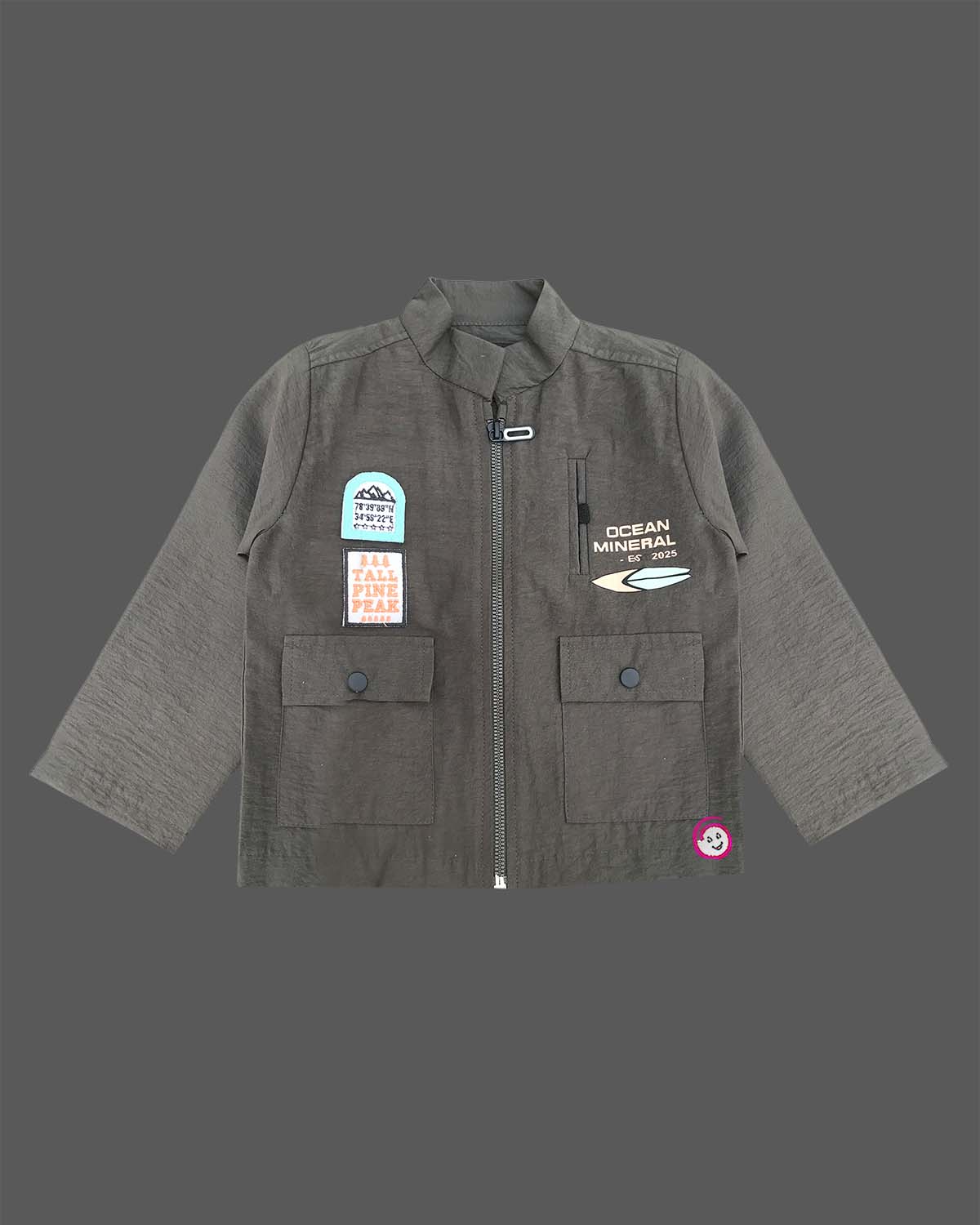 Modern two-piece casual set for toddler boys featuring a zip-front high-neck shirt jacket with graphic patches alongside matching cargo pants.