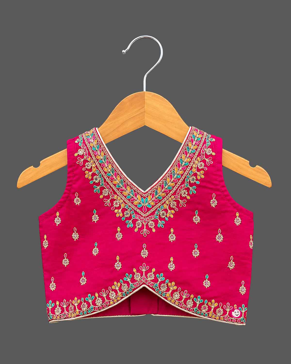 Embroidered V-neck lehenga choli for kids set featuring intricate threadwork, pleated skirt, and sheer dupatta