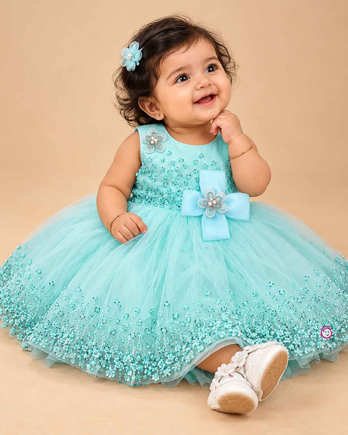 Girls sequined net fit-and-flare frock with floral embellishments and bow applique for birthday parties