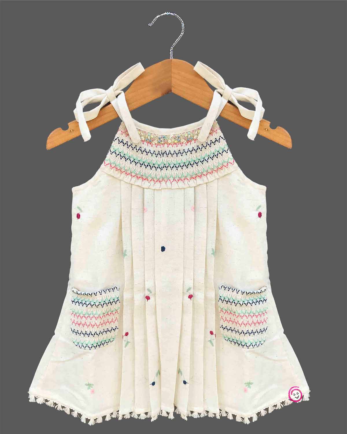Little girl embroidered cotton frock with round neck and ribbon shoulder tie ups for birthday party and summer gathering