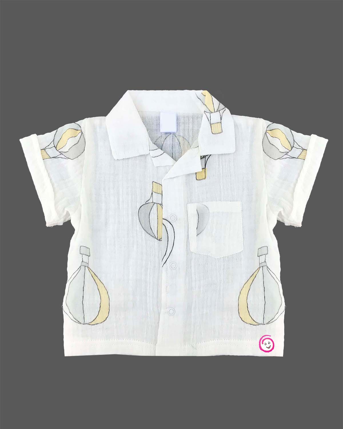 Boys 2-piece cotton casual co-ord set featuring a short-sleeve collared printed shirt and matching shorts in white with pastel yellow and grey hot air balloon prints