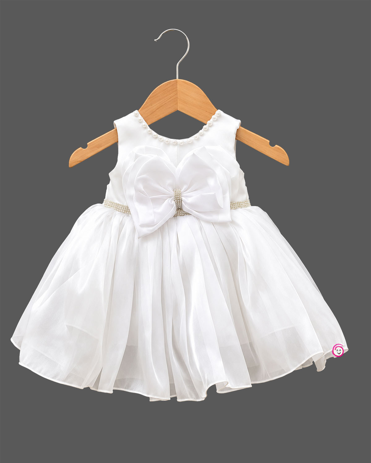 Infant girl sleeveless party frock with large front bow, beaded waistband, and pearl embellished neckline for special occasions