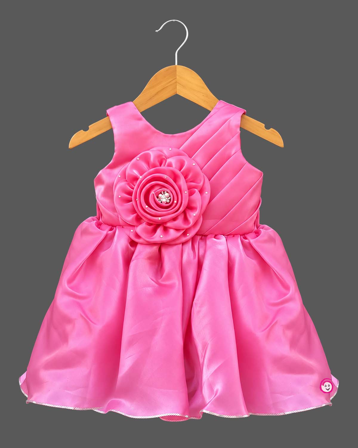 Silk frocks for baby girl featuring rosette bodice and pleated fit-and-flare satin skirt