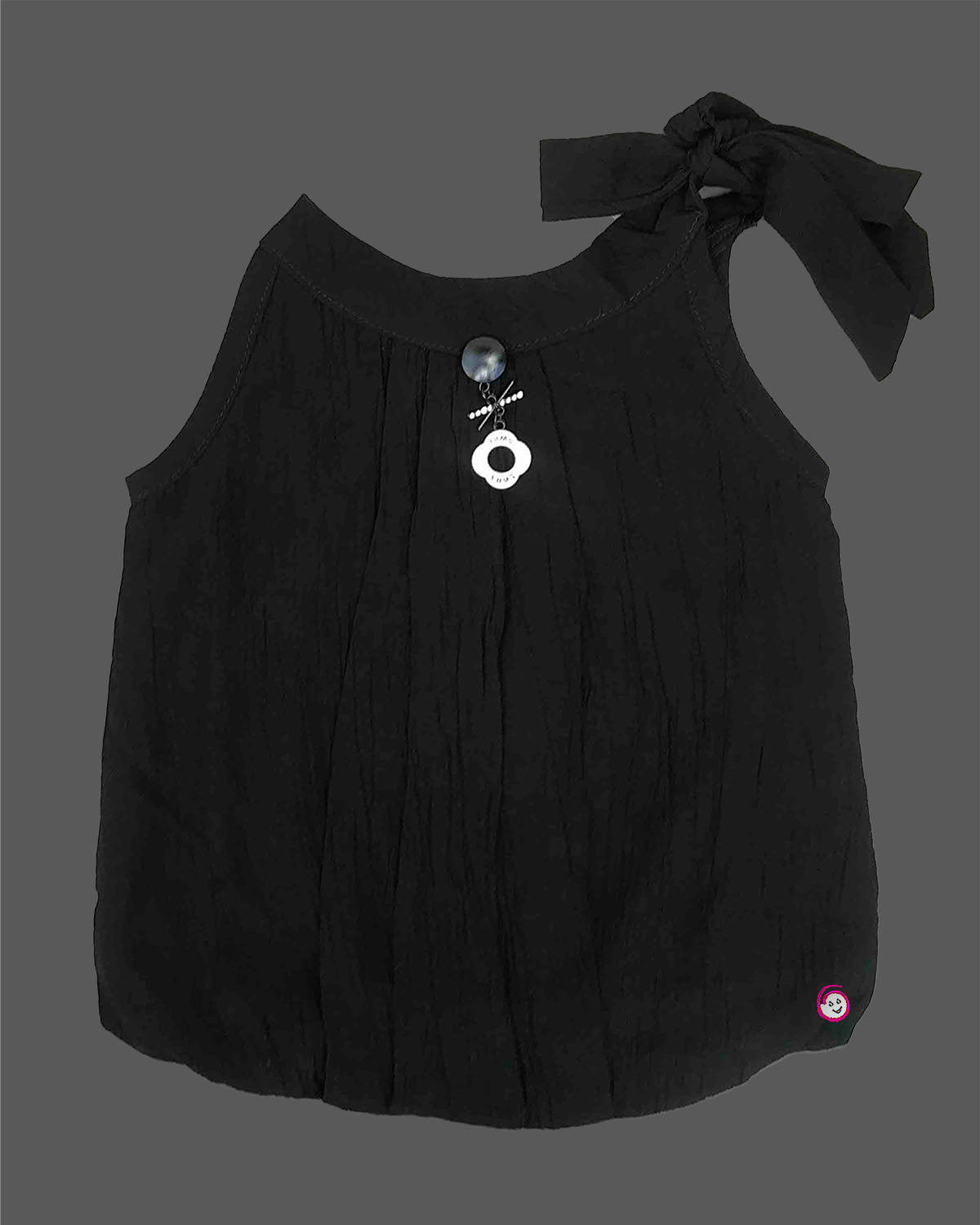 Girls tie shoulder sleeveless top with bow strap detail and charm accent, trendy girlish party wear dress alternative.