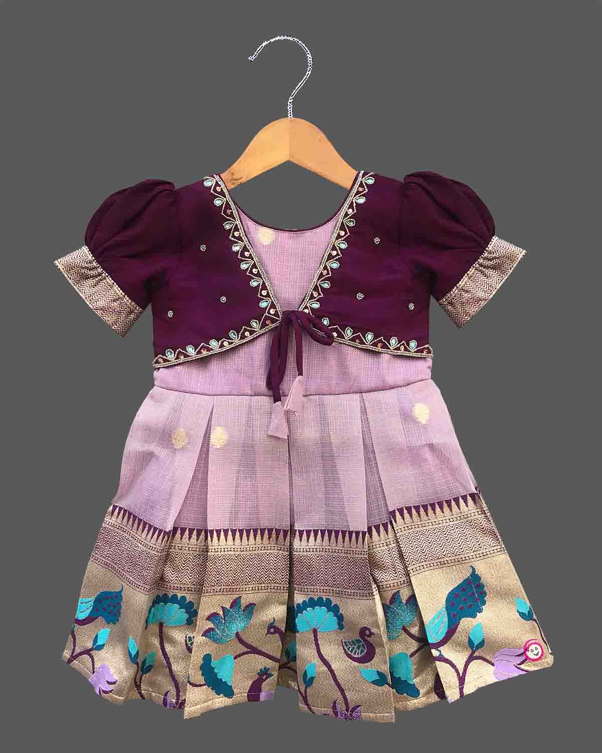 Charming ethnic pattu pavadai style cotton silk frock for baby girls with gold zari border and traditional motifs