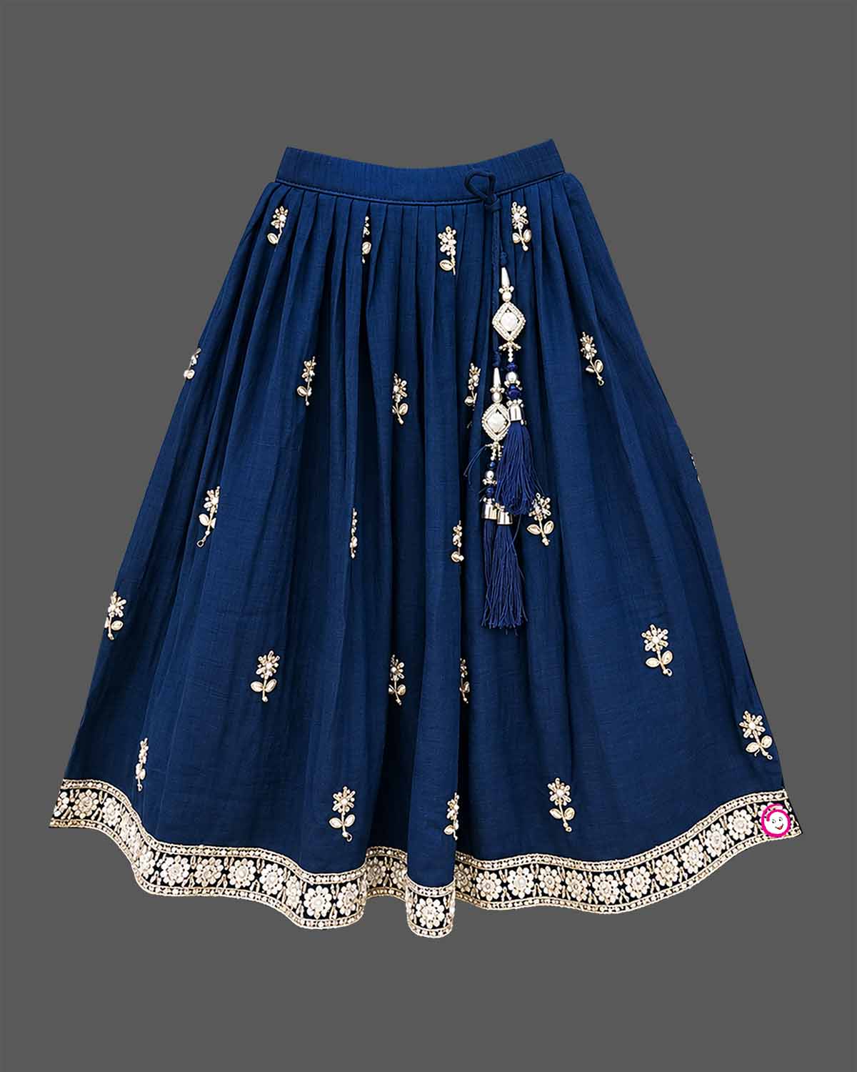 Girls sleeveless embroidered choli lehenga set with beaded fringe hem, tassel drawstring, and pleated flared skirt.