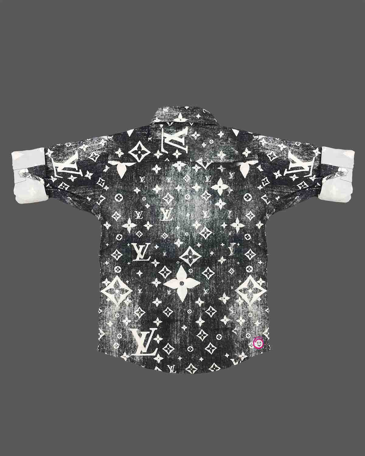 Stylish toddler boys shirt featuring an all-over classic designer motif print with double front flap pockets.