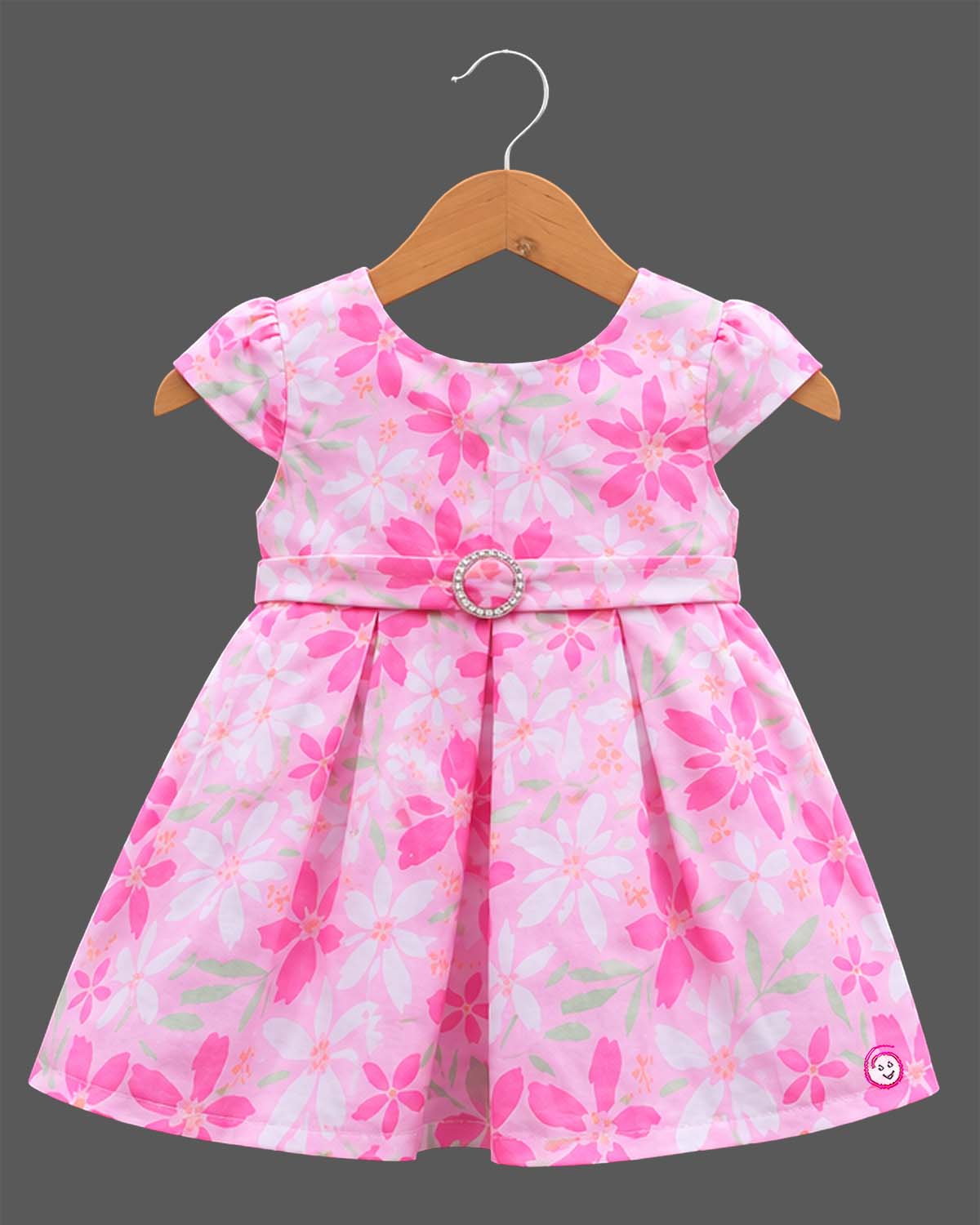 Girls floral box pleated frock with cap sleeves, round neck, and embellished buckle waist belt.