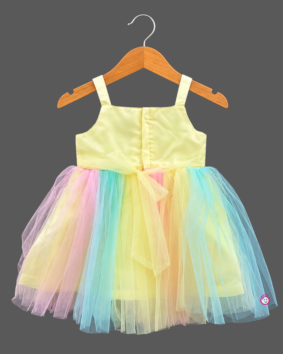 Sleeveless sequin bodice tulle frock with a front bow applique for kids wedding dress occasions.