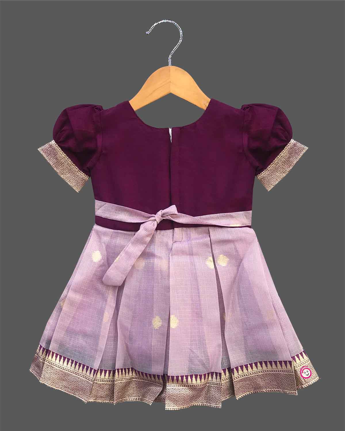 Charming ethnic pattu pavadai style cotton silk frock for baby girls with gold zari border and traditional motifs