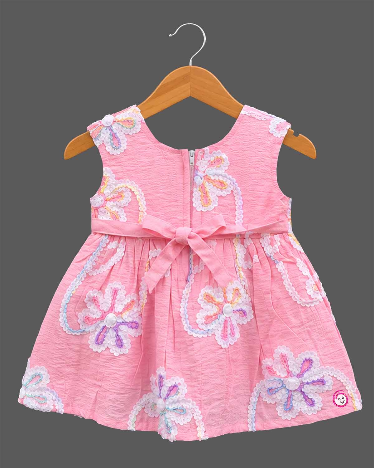 Baby girls sleeveless textured cotton frock with sequin floral embroidery and gathered waistline