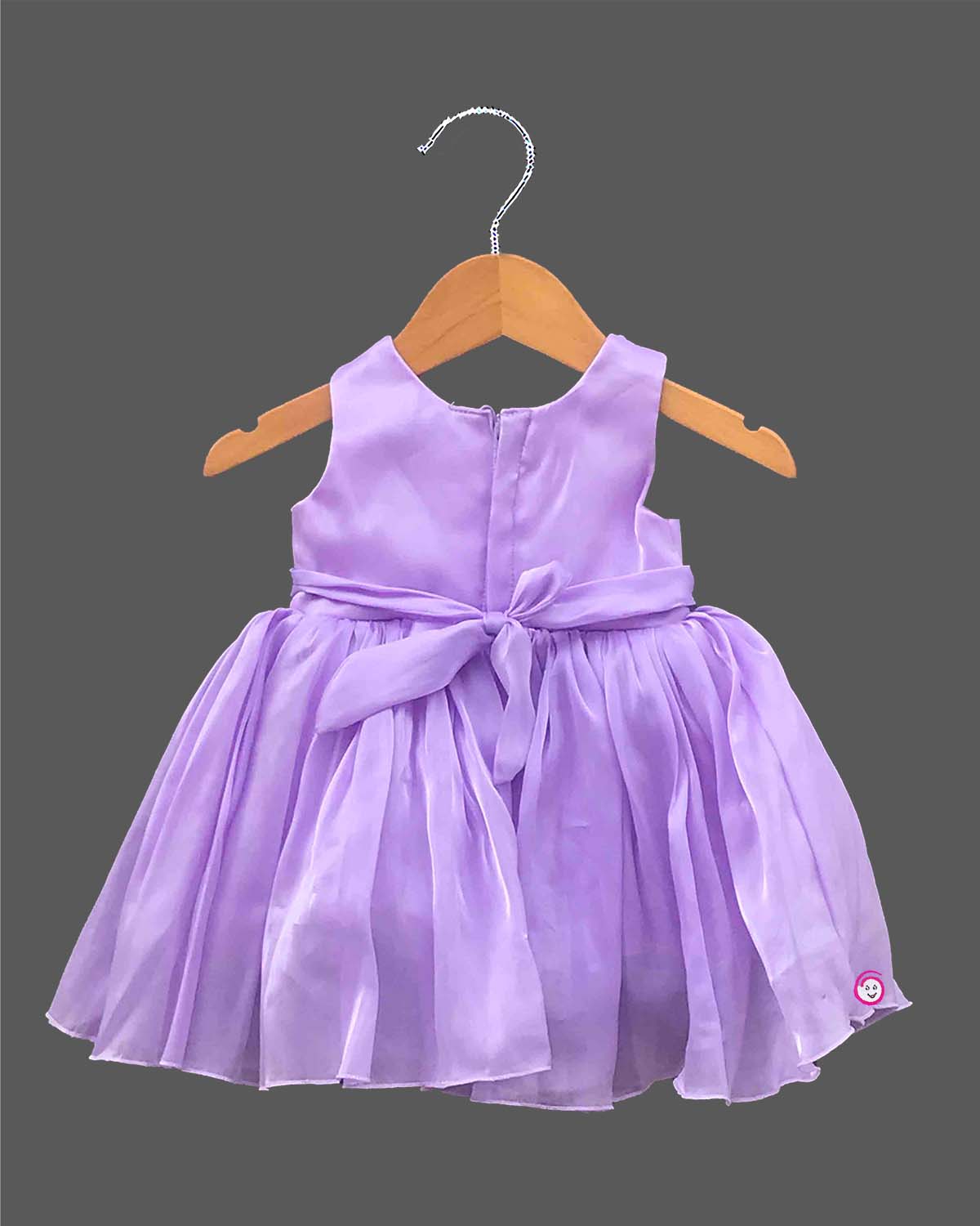 Infant satin party frock with statement bow and pearl neckline for baby girls