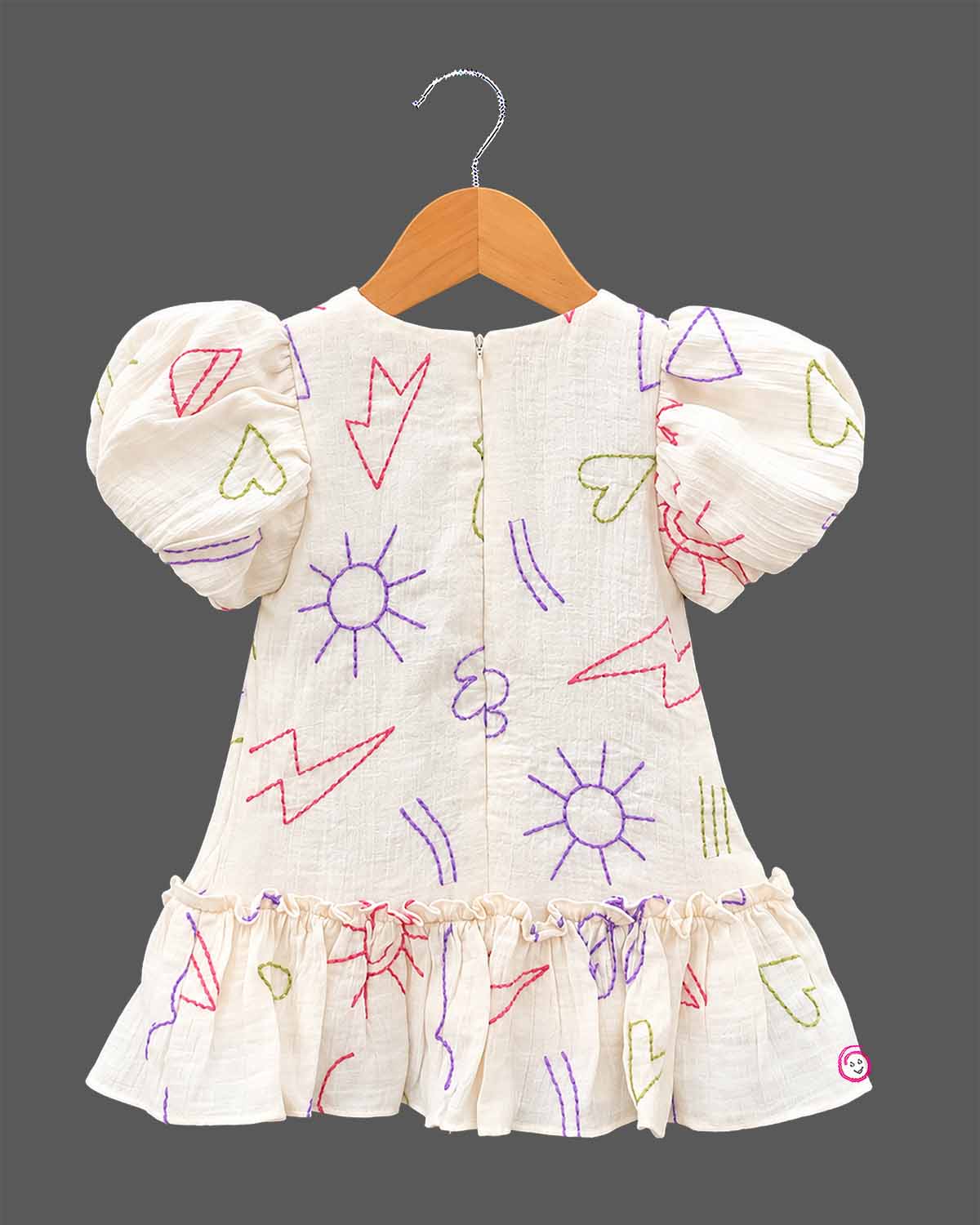 Girls casual printed frock with puff sleeves, front bow accent, and ruffled hem