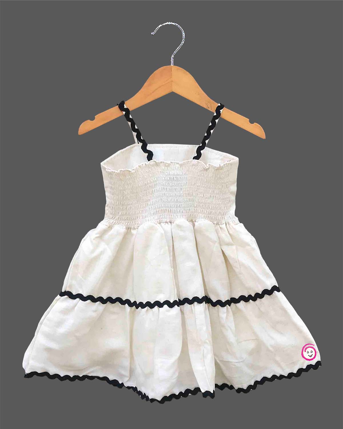 Baby Girl Tiered Frock with flower applique and zig-zag trim detailing for birthday Western wear.