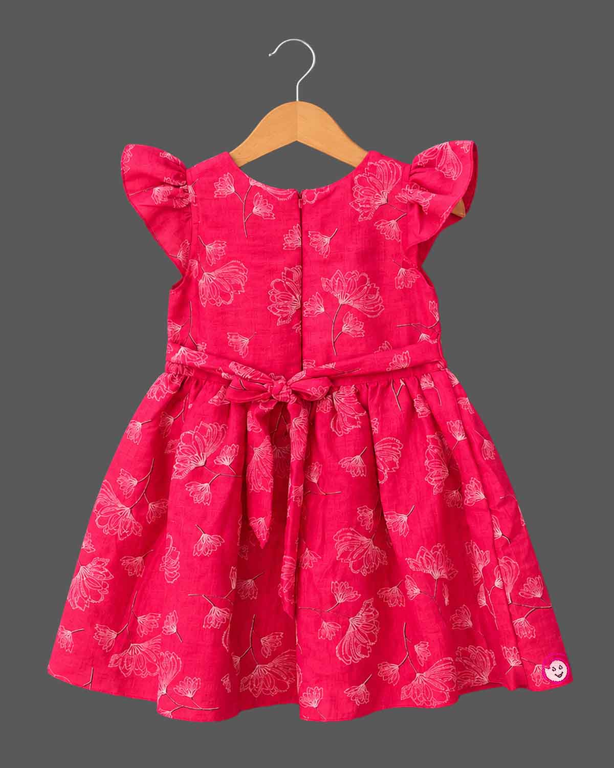 Cotton Frock For Baby Girl with flutter sleeves, V-neck bodice, gathered skirt and sketch floral print