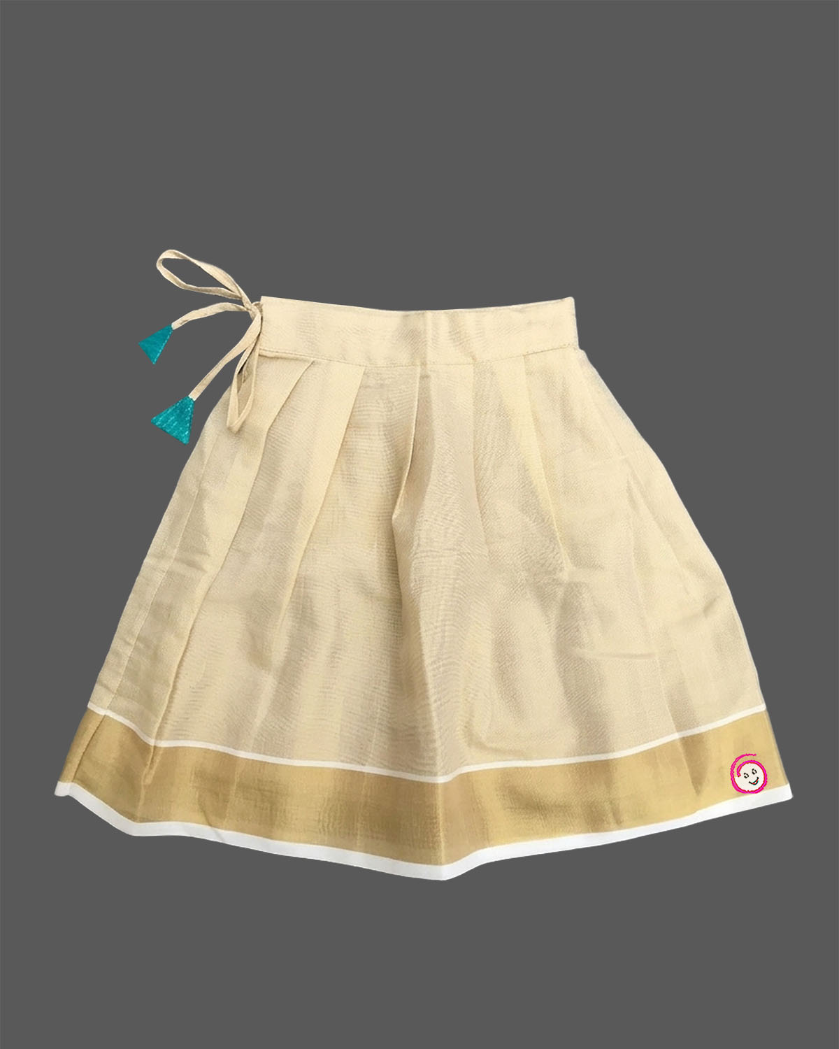 Little darling two-piece traditional festive ethnic outfit with floral chest brooch and pleated zari bordered skirt.