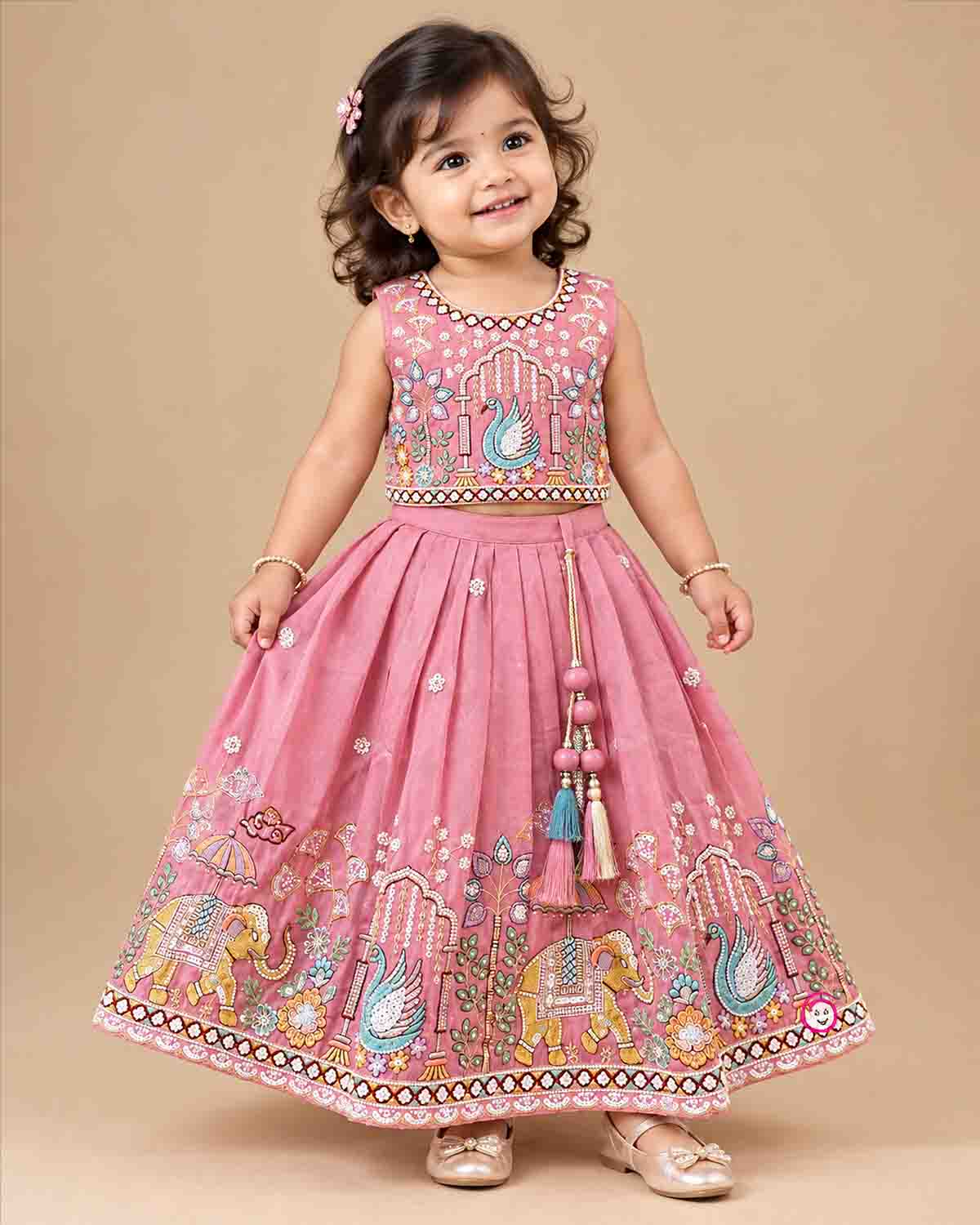 Designer baby girl lehenga set featuring hand-embroidered sequin motifs, sleeveless choli, and pleated flared skirt