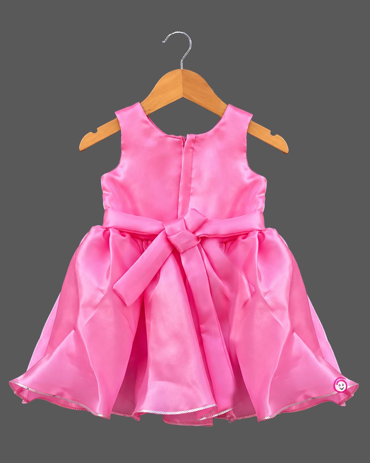 Silk frocks for baby girl featuring rosette bodice and pleated fit-and-flare satin skirt
