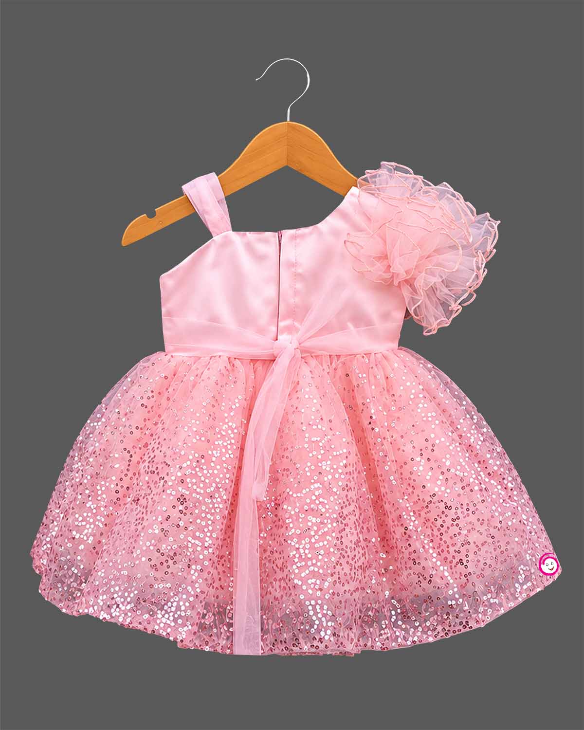 Girls sequin mesh one shoulder party frock with ruffled shoulder and waist bow detail