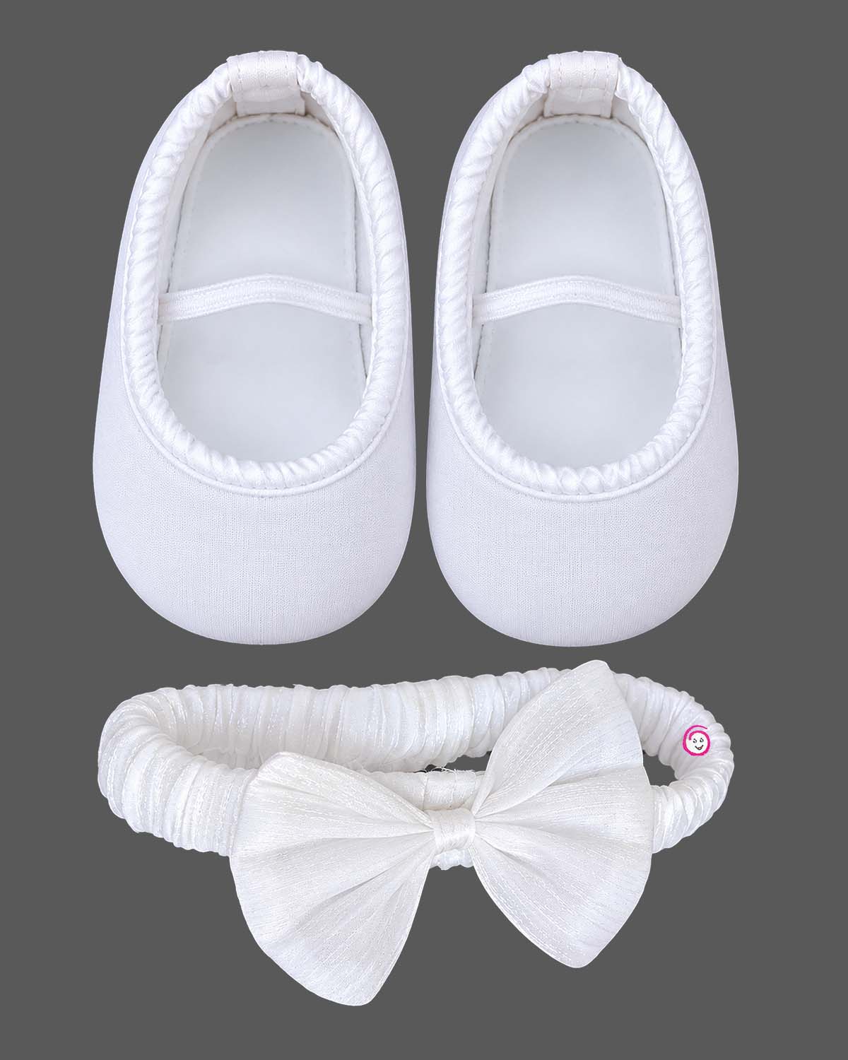 Flared netting baby party wear dress with oversized bodice rosette, matching bow headband, and soft booties.
