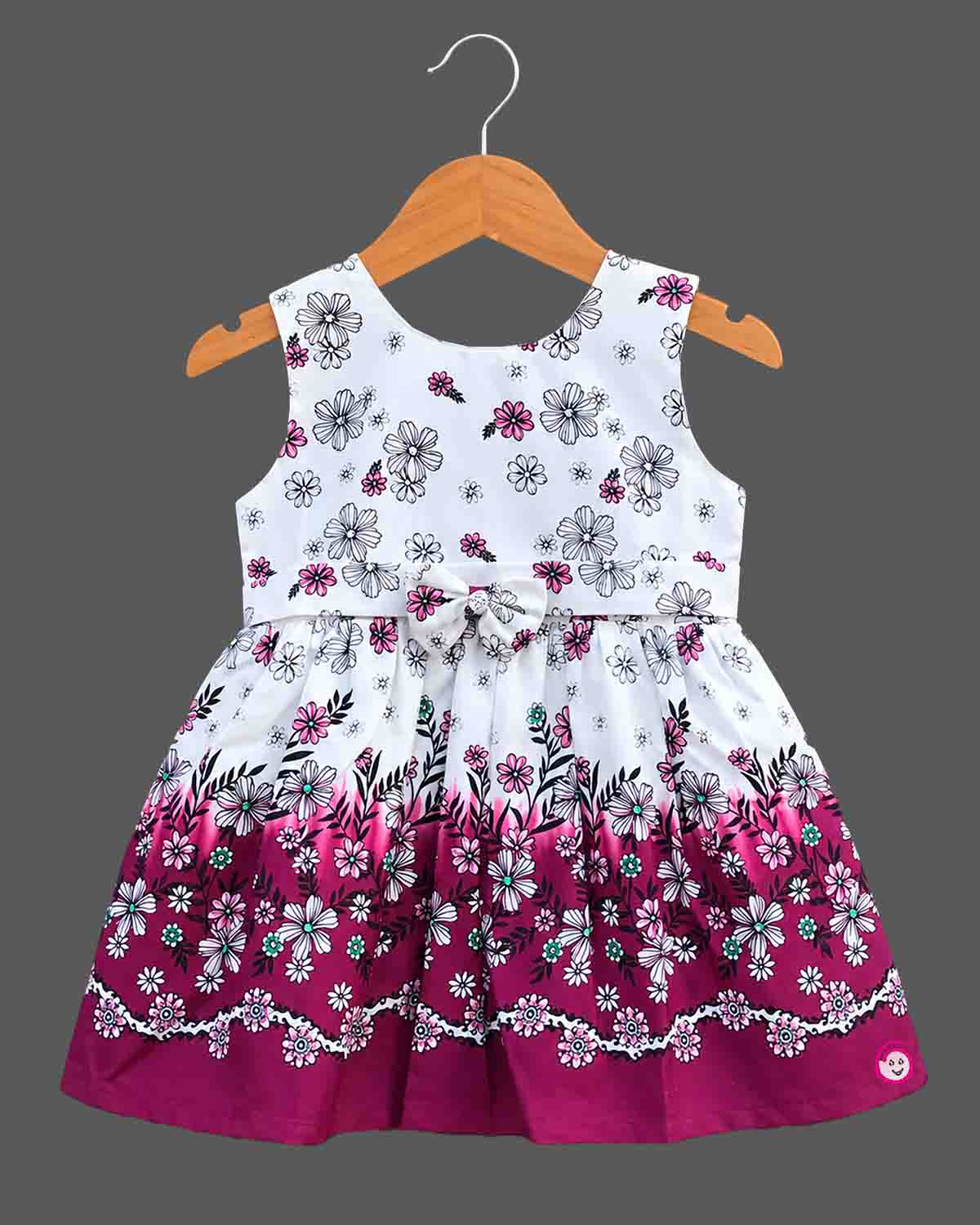 Sleeveless floral printed cotton frock with bow detail for baby casual wear dress collection.