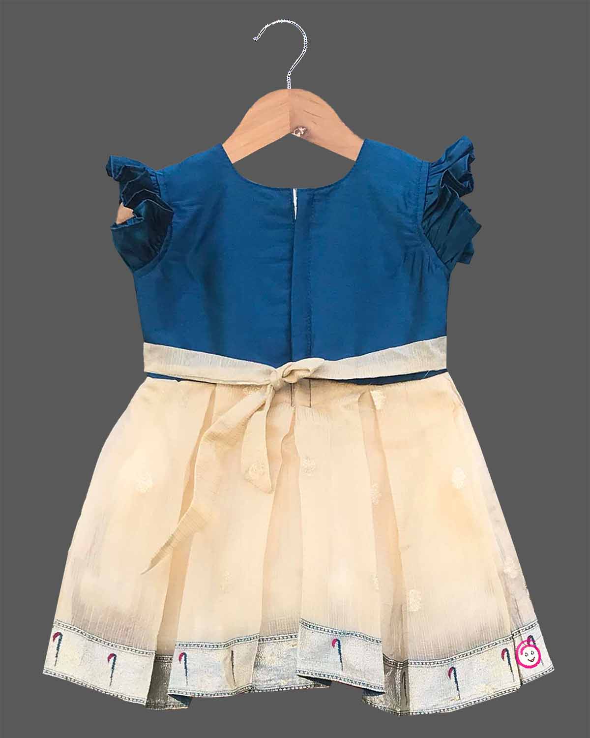Infant cotton silk frock in teal blue and cream with multicolored bird and floral kalamkari border work, neckline embroidery, and ruffle sleeves