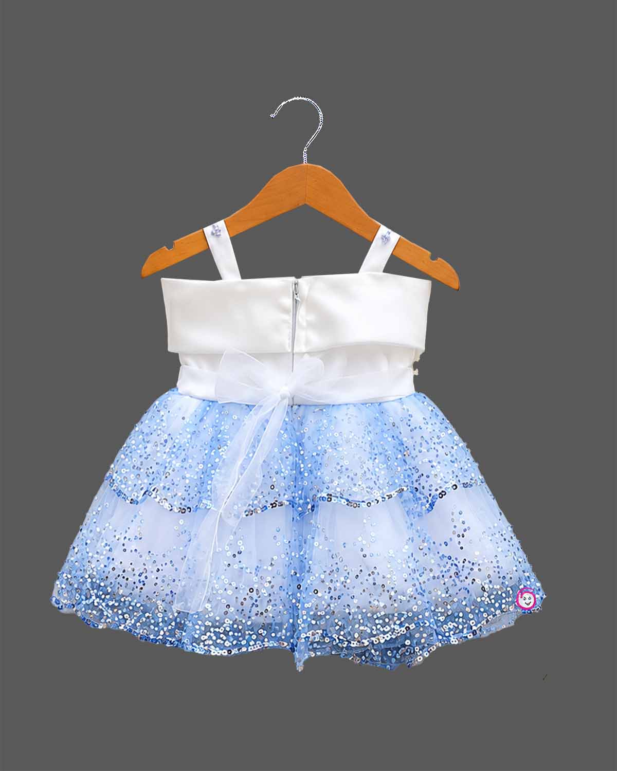 Sequined tiered tulle baby party wear dress featuring satin bow and floral pearl accent