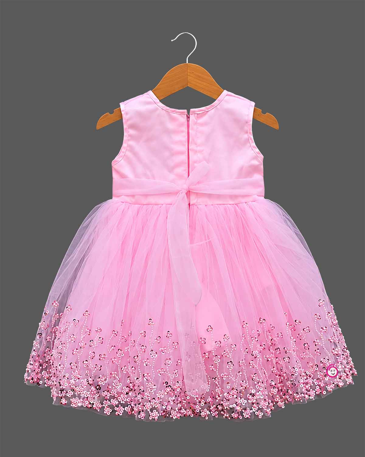 Girls sleeveless tulle party frock with sequined bodice embroidery, pearl flower applique bow, and flared net skirt
