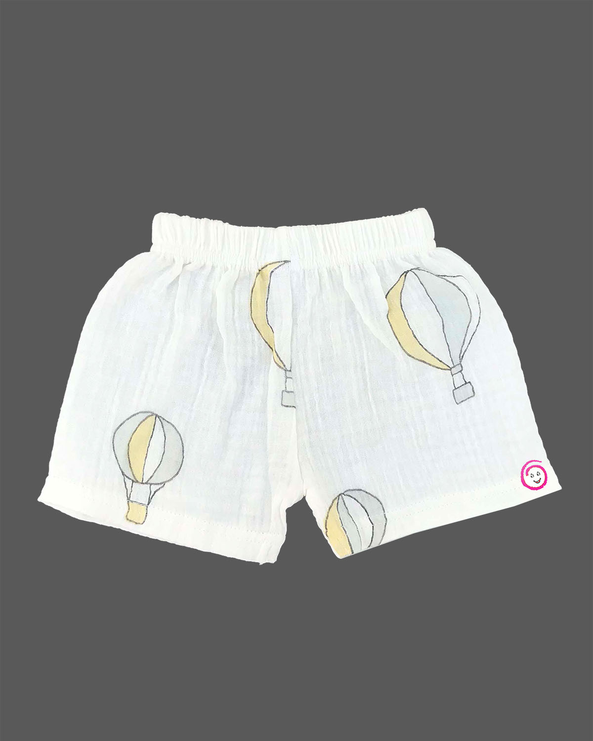 Boys 2-piece cotton casual co-ord set featuring a short-sleeve collared printed shirt and matching shorts in white with pastel yellow and grey hot air balloon prints