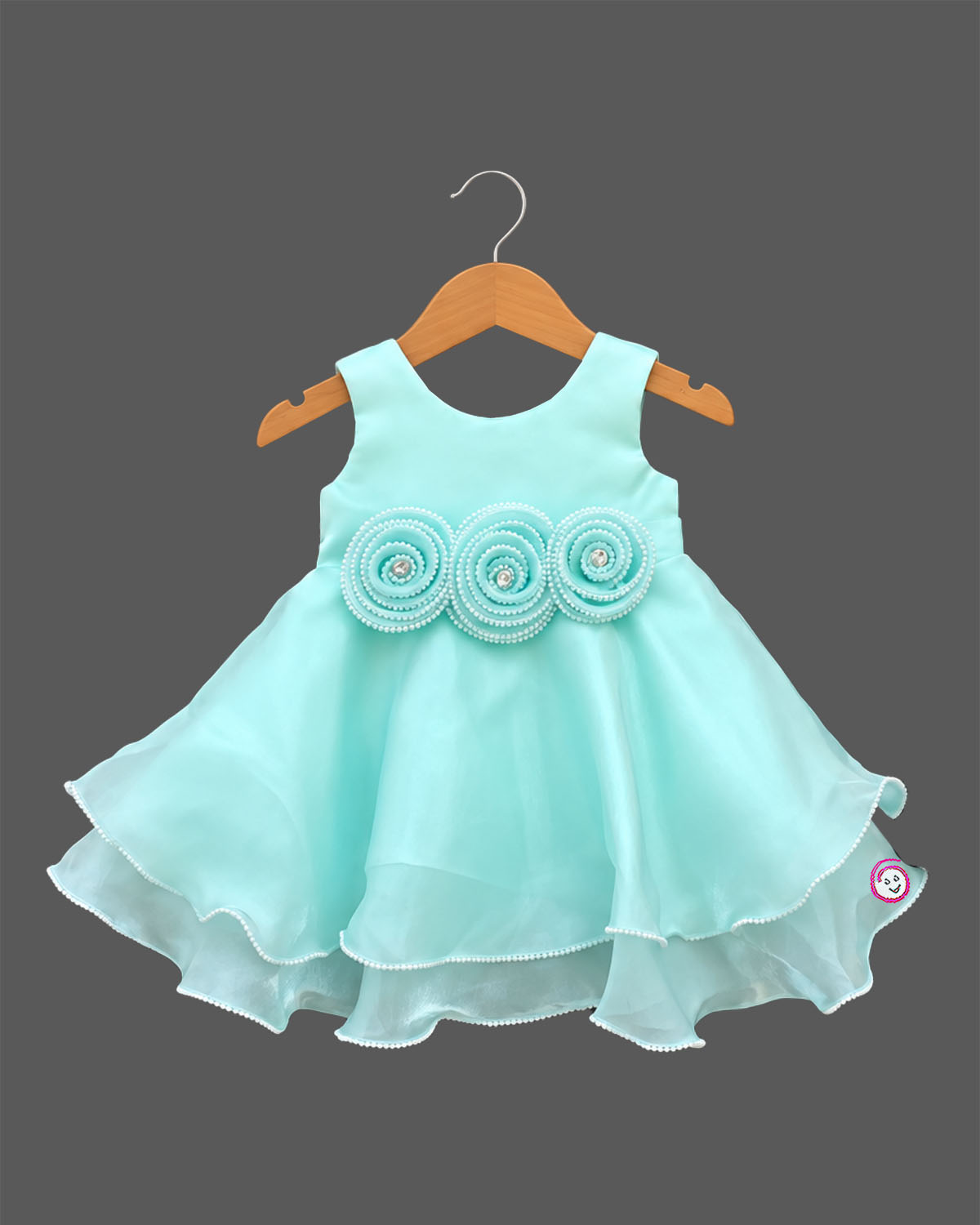 Sleeveless tiered organza party frock with beaded waist rosettes and ruffled hem