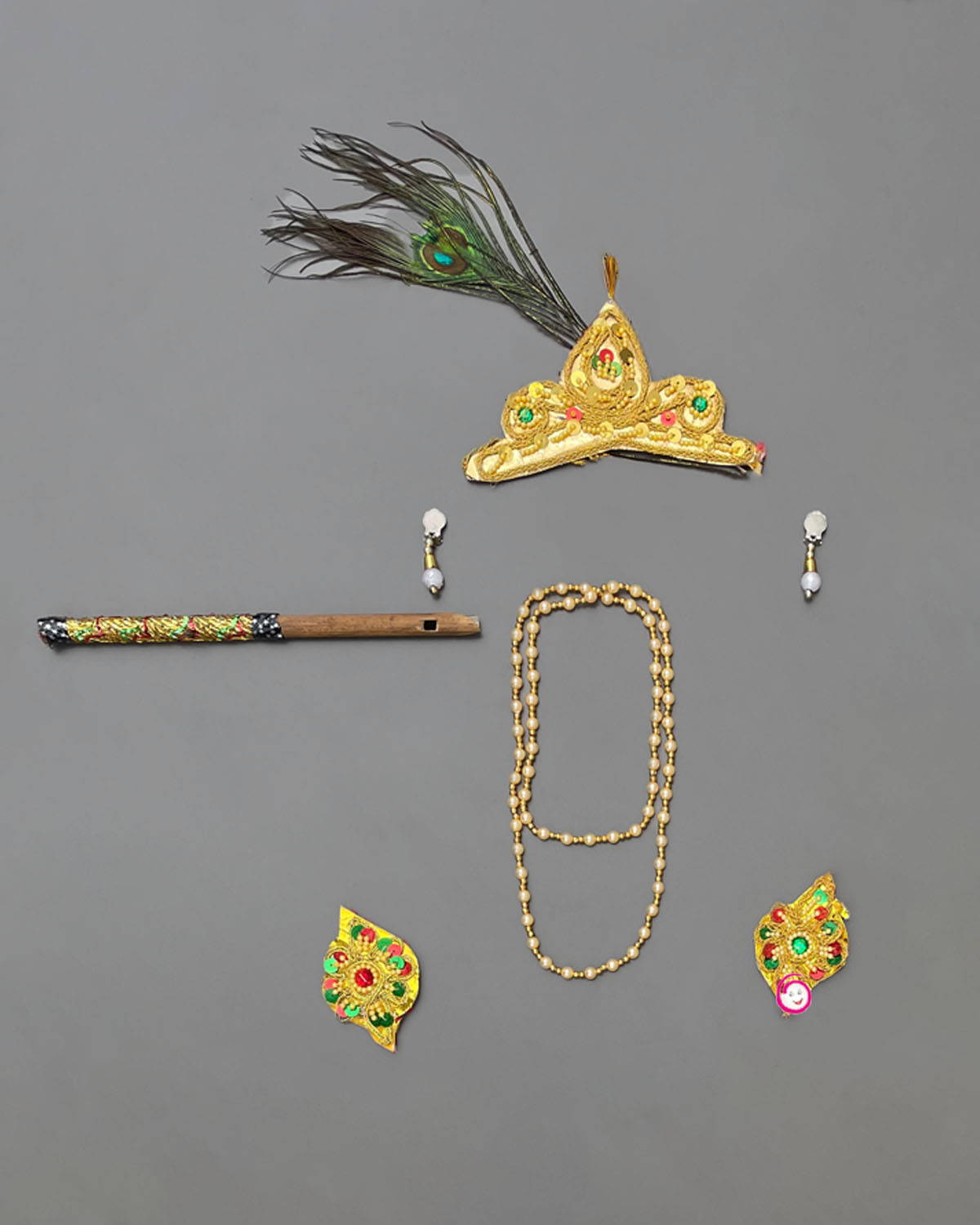 Infant Krishna dress featuring silk dhoti patka sash mukut with peacock feather flute and necklace