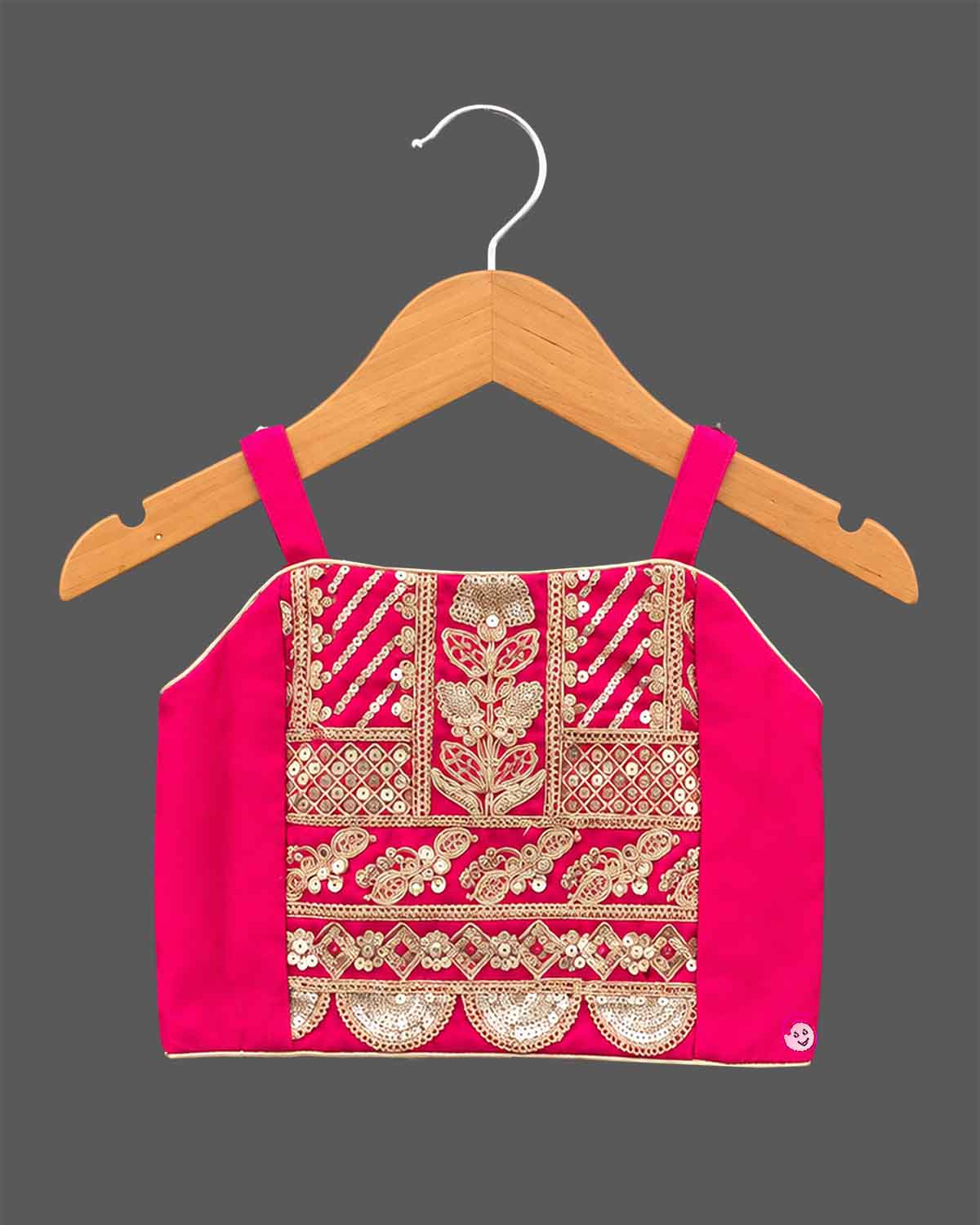 Girls embroidered choli top, flared lehenga skirt, and matching open-front sleeveless jacket.