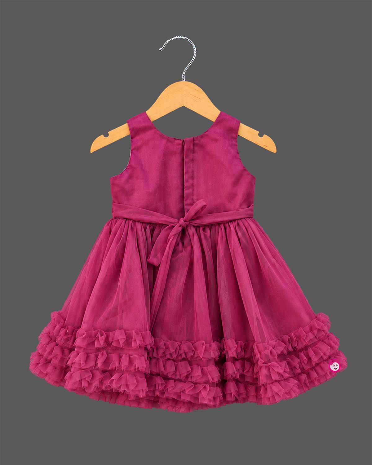 Toddler party frock with pleated diagonal bodice floral applique waist and tiered ruffle net flared skirt