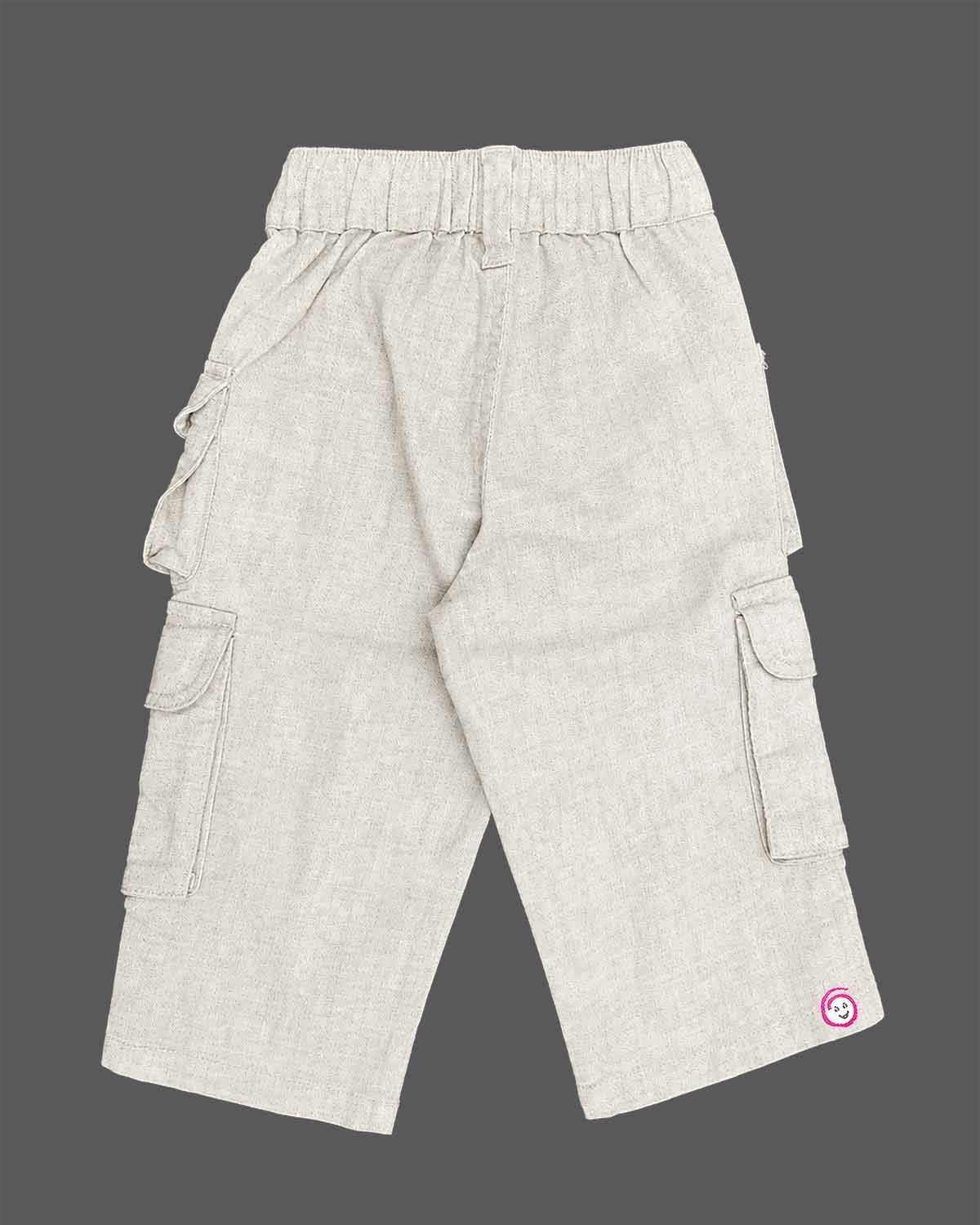Smart casual cargo pant for young gentleman with multiple flap pockets, elasticized waist, button fastening, and logo badge patch.