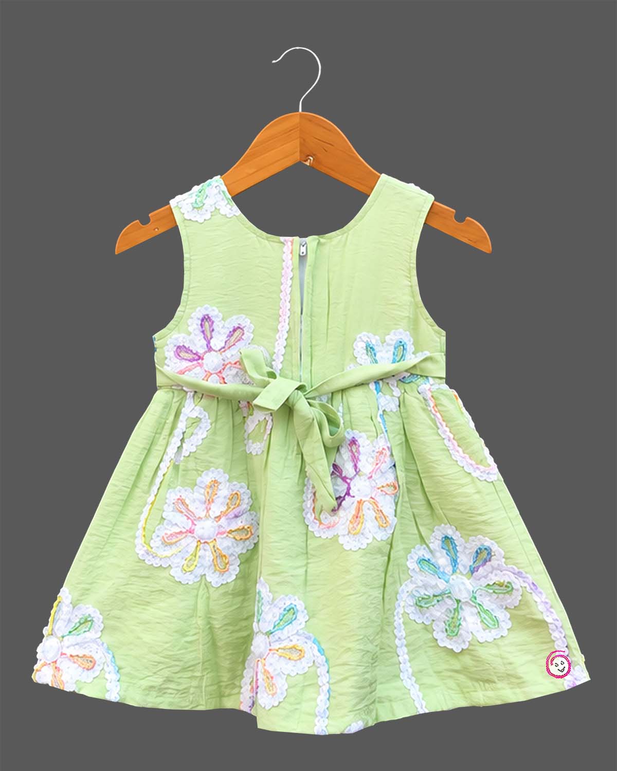 Sleeveless cotton A-line frock with floral lace appliqués and round neck for girls.