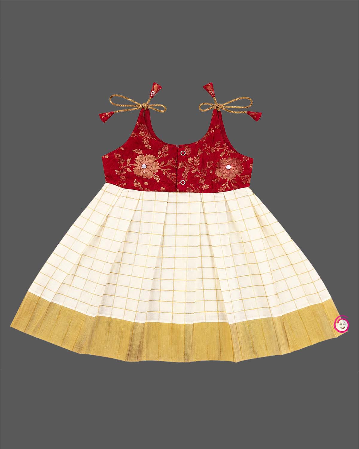 Little princess wearing traditional Kasavu pleated frock with floral brocade bodice for festive celebrations