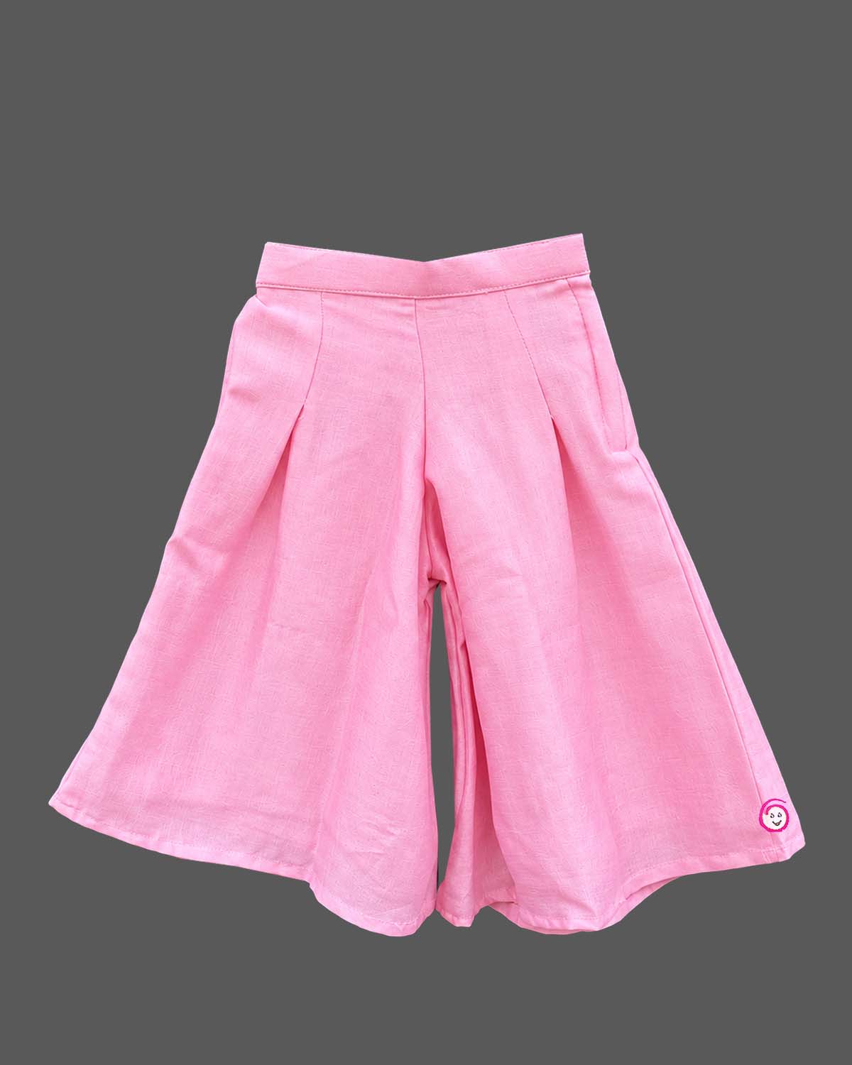 Sleeveless kurti for kids with asymmetric tassel hem and wide-leg pleated palazzo pants.
